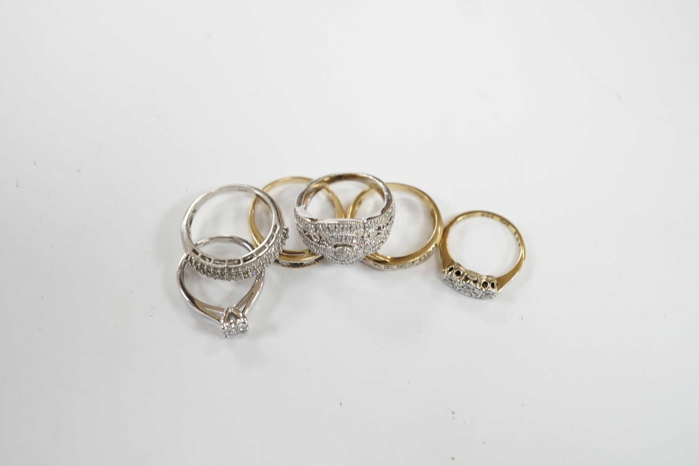 Five assorted modern 9ct and gem set rings including diamond chip cluster and sapphire and diamond chip, gross weight 12.7 grams, together with a 925 and diamond chip cluster set ring.